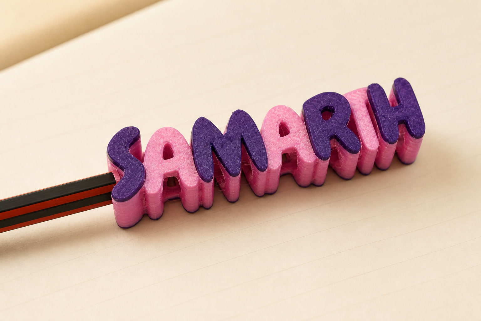 Close view of a pink and purple personalized SAMARTH pencil name tag
